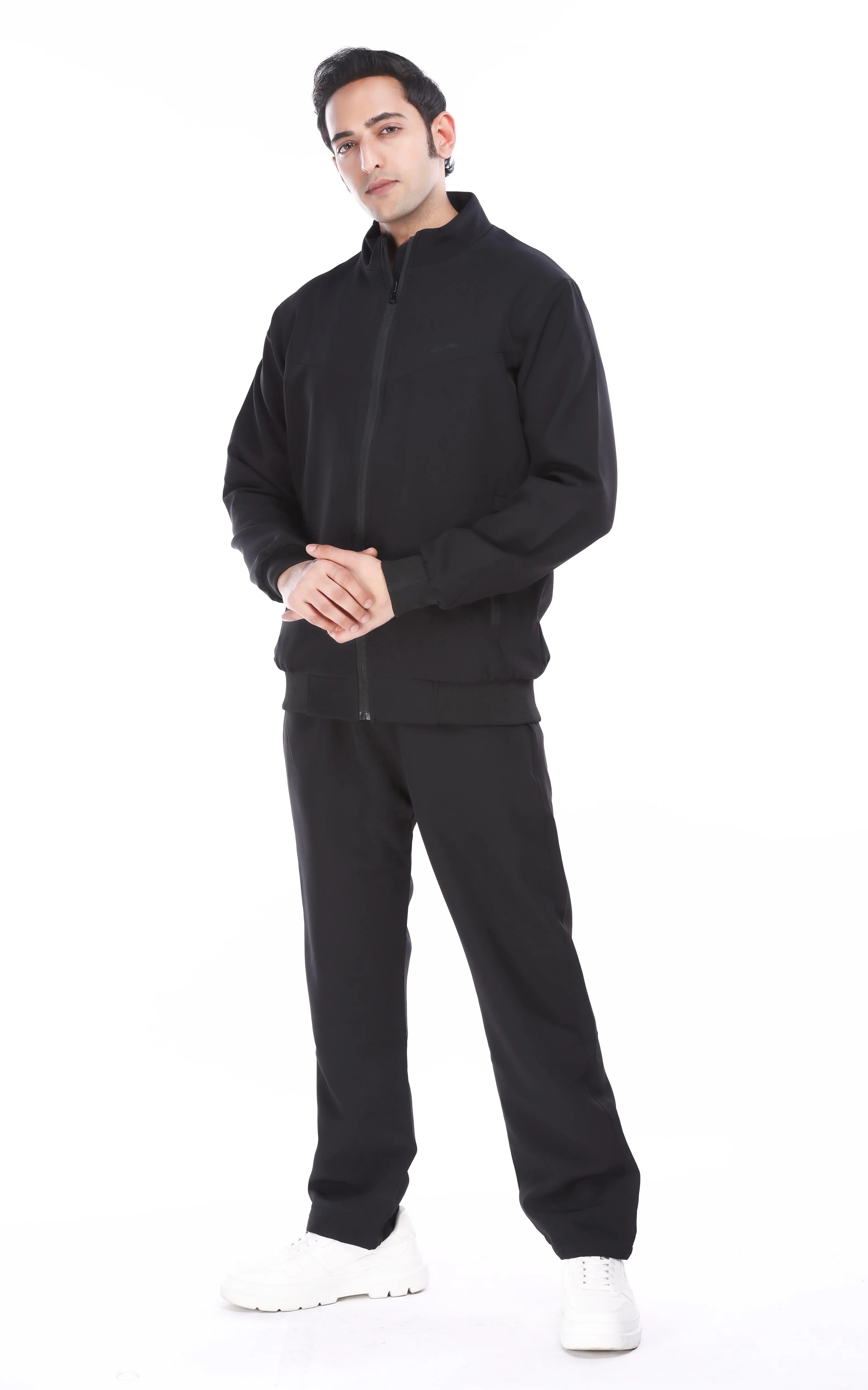 Model wearing RFORTUNE's Mens solid black tracksuit with white shoes, image used for RFORTUNE's mens tracksuit collection