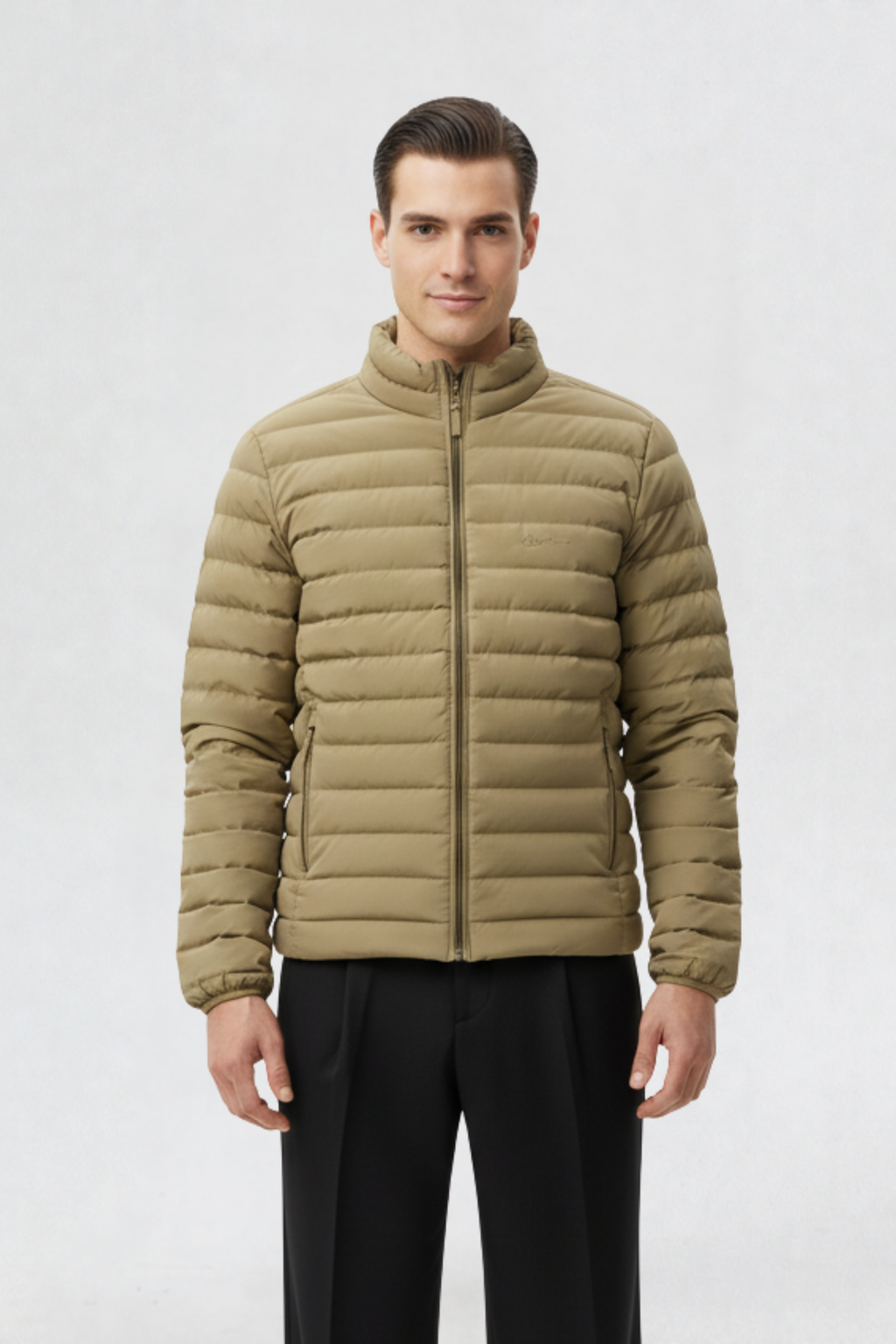 Male model wearing a mens puffer jacket in beige with full zip closure