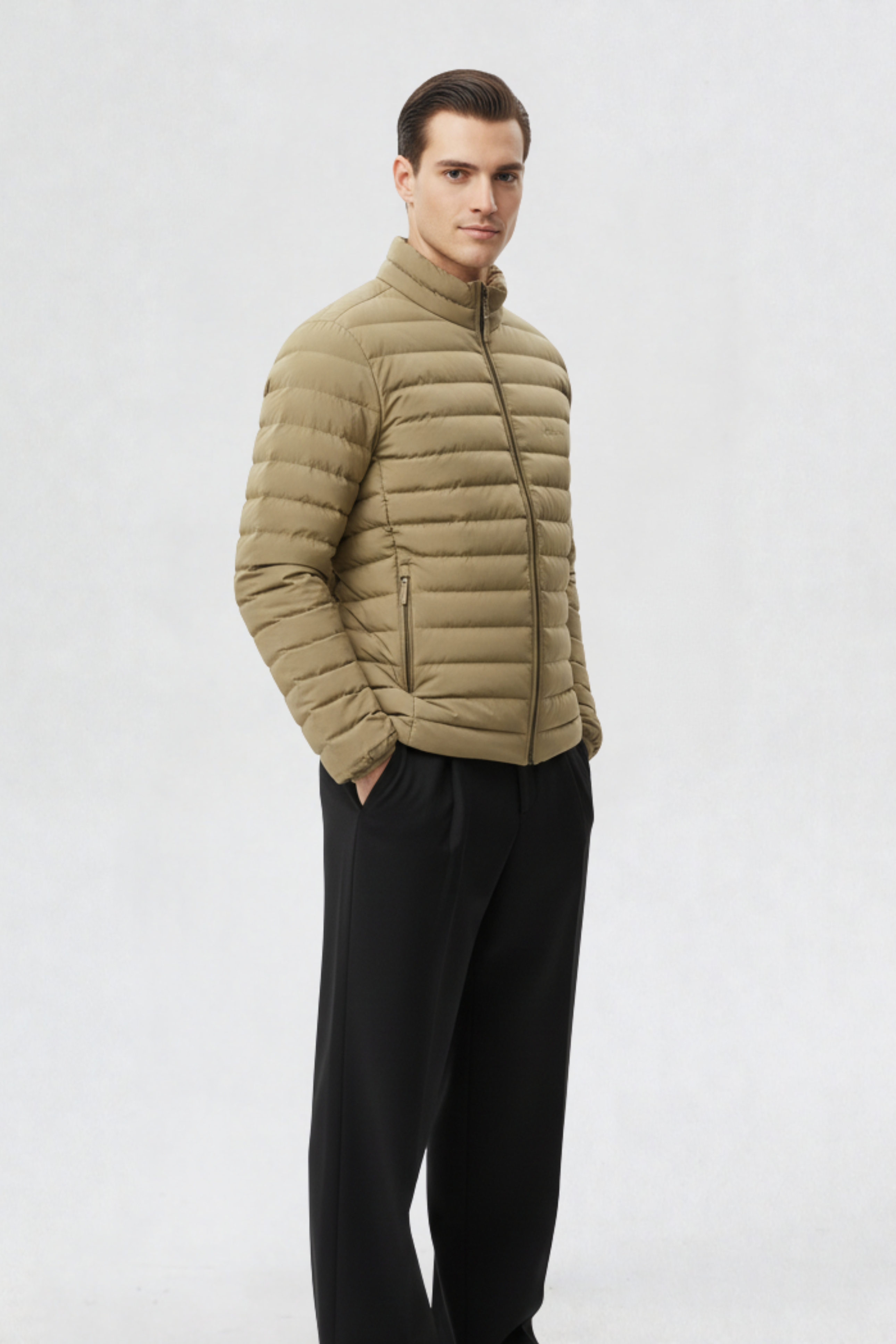 Side profile of a man wearing a beige mens puffer jacket