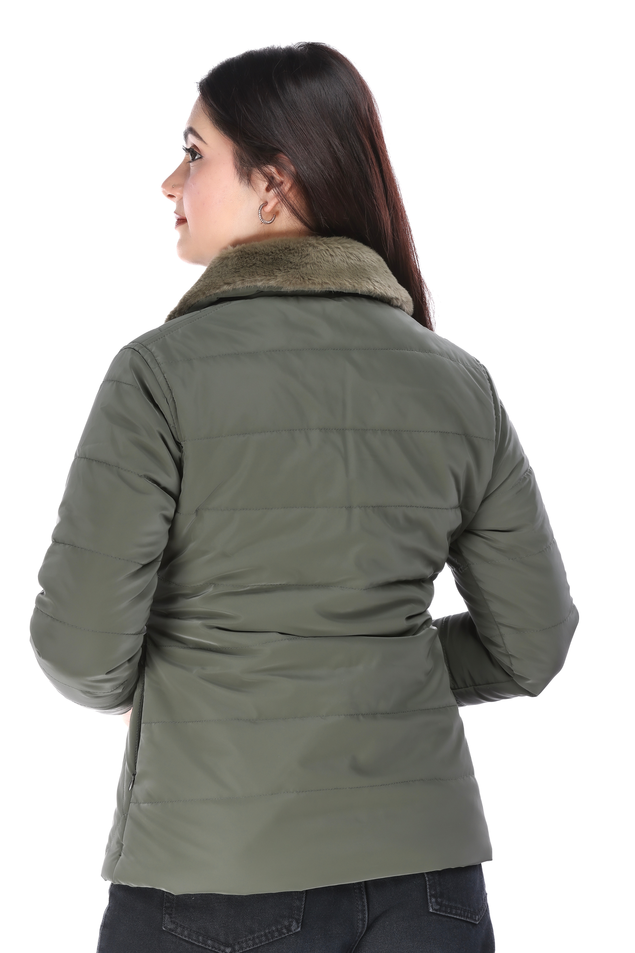 Rear view of woman showcasing the back design of the olive quilted jacket with faux fur collar.