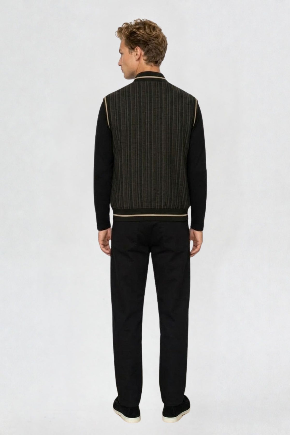 Back view of black mandarin collar half sleeve jacket showing striped pattern and tan-trimmed hem