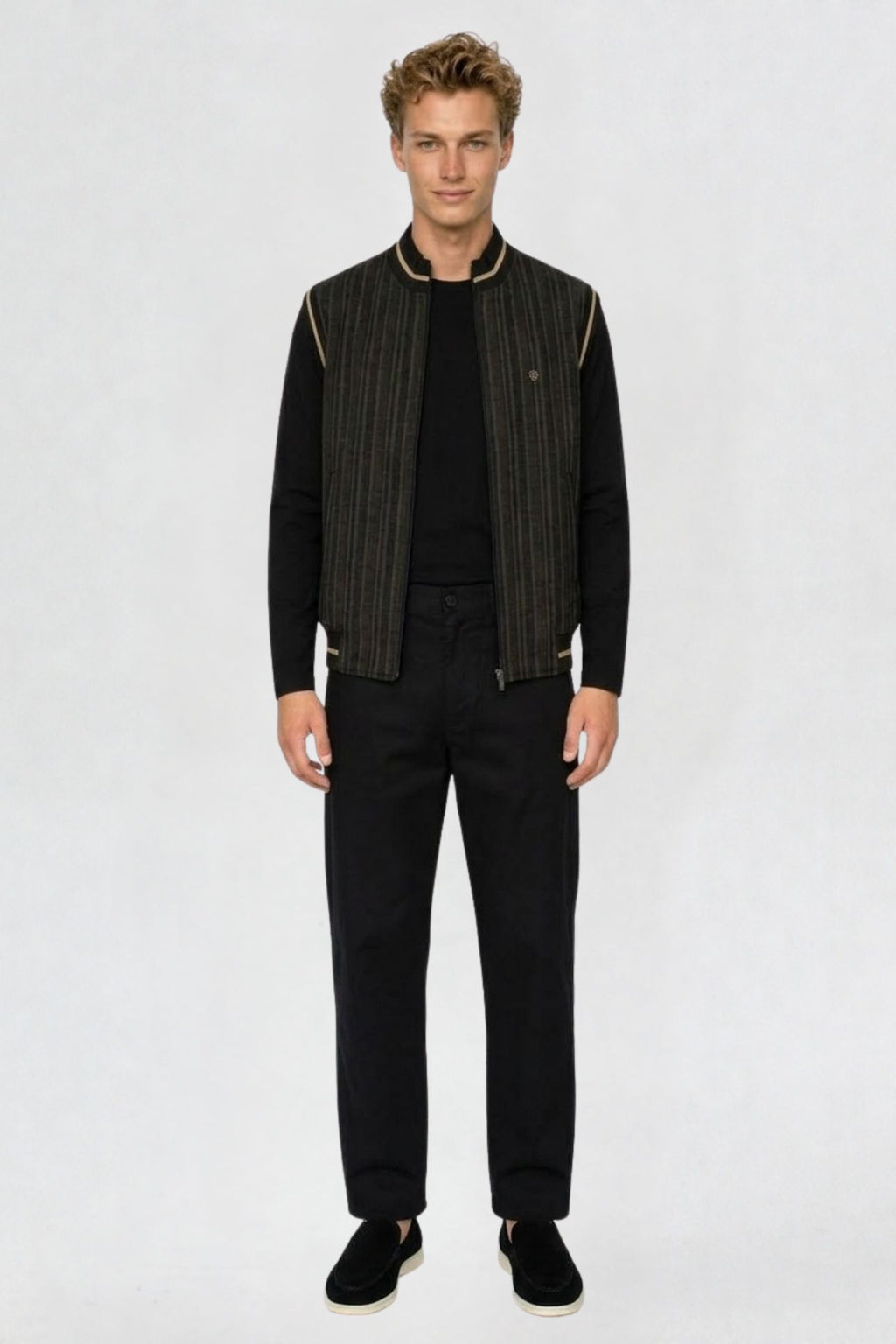 Men's black mandarin collar half sleeve jacket, full front view, striped fabric with tan-trimmed collar and armholes, worn over black long sleeve top and trousers
