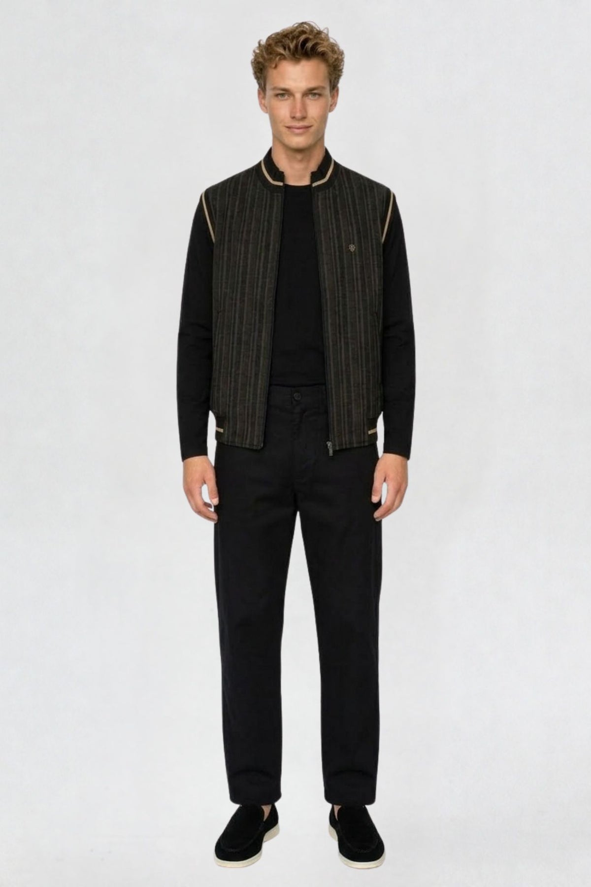 Men's black mandarin collar half sleeve jacket, full front view, striped fabric with tan-trimmed collar and armholes, worn over black long sleeve top and trousers
