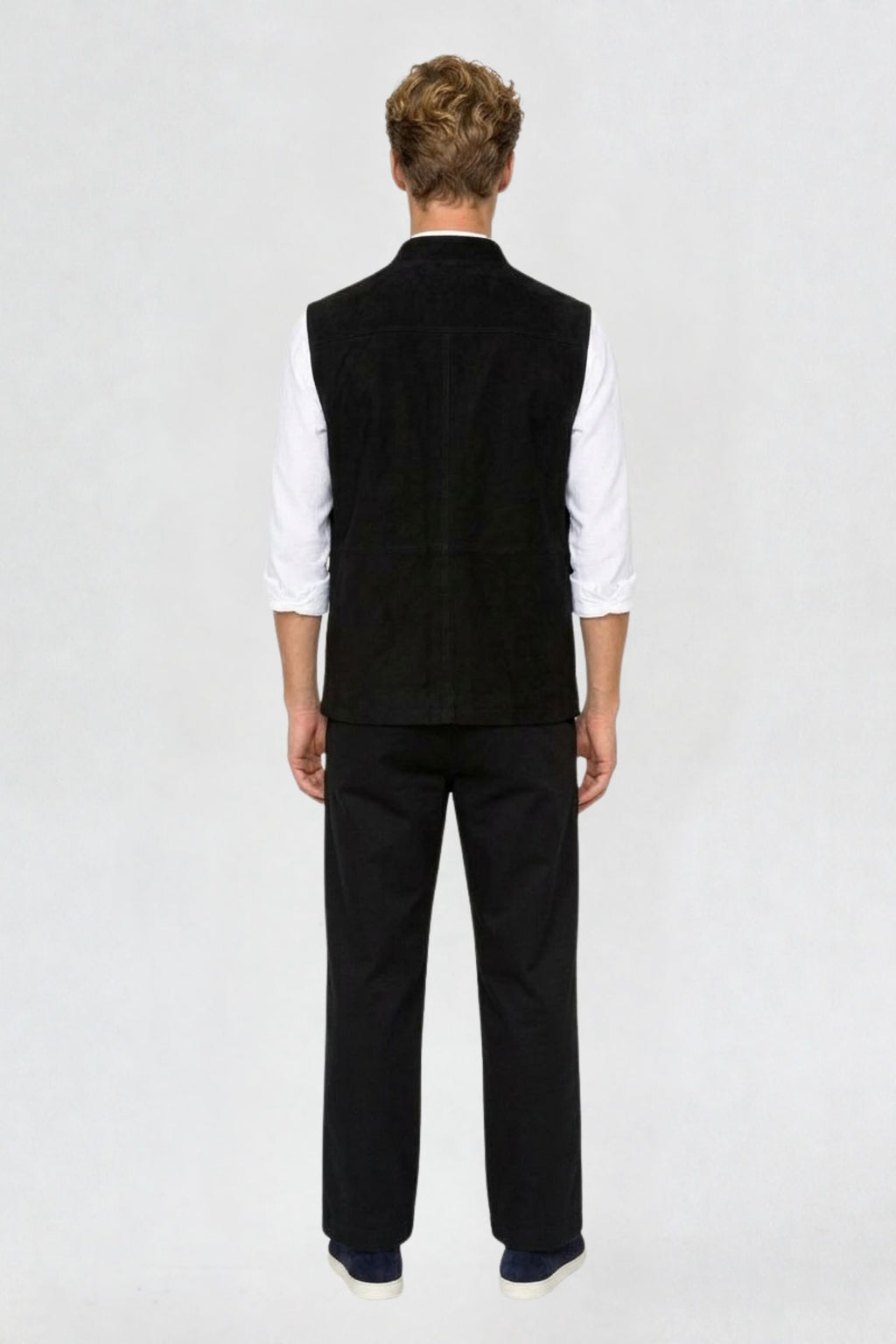 Back view of black tweed cargo half sleeve jacket showing tailored back seam and straight hem