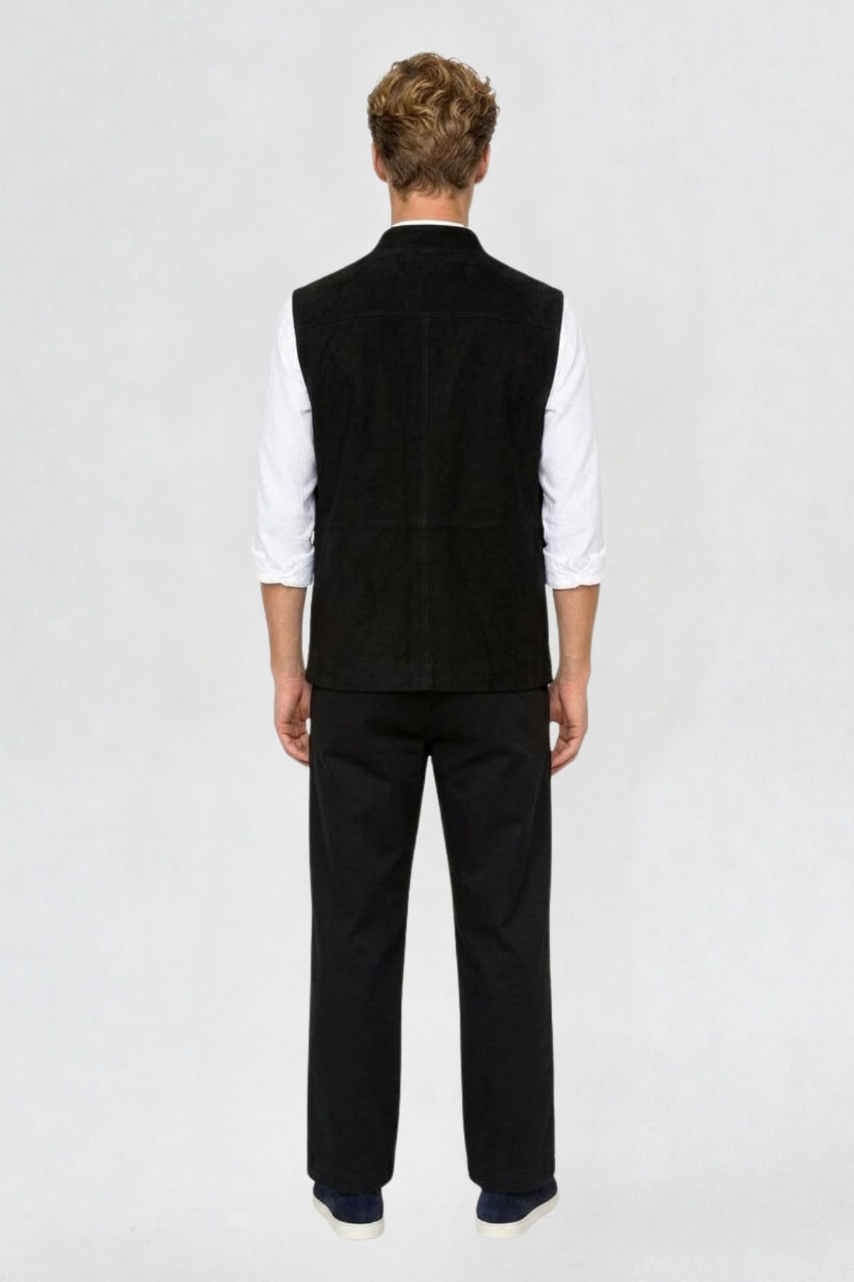 Back view of black tweed cargo half sleeve jacket showing tailored back seam and straight hem