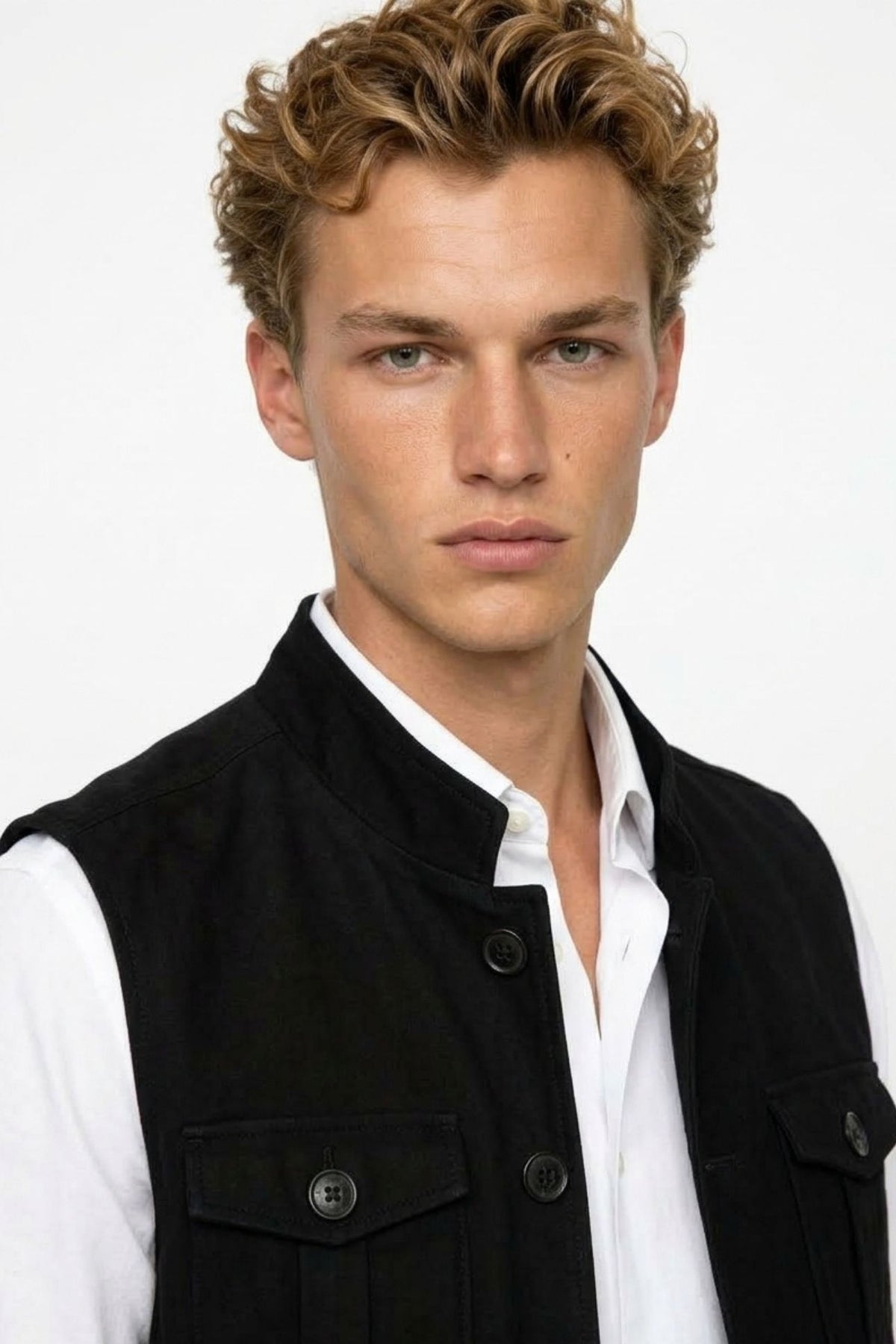Close-up of black tweed cargo half sleeve jacket showing mandarin collar, button front, and flap pocket stitching