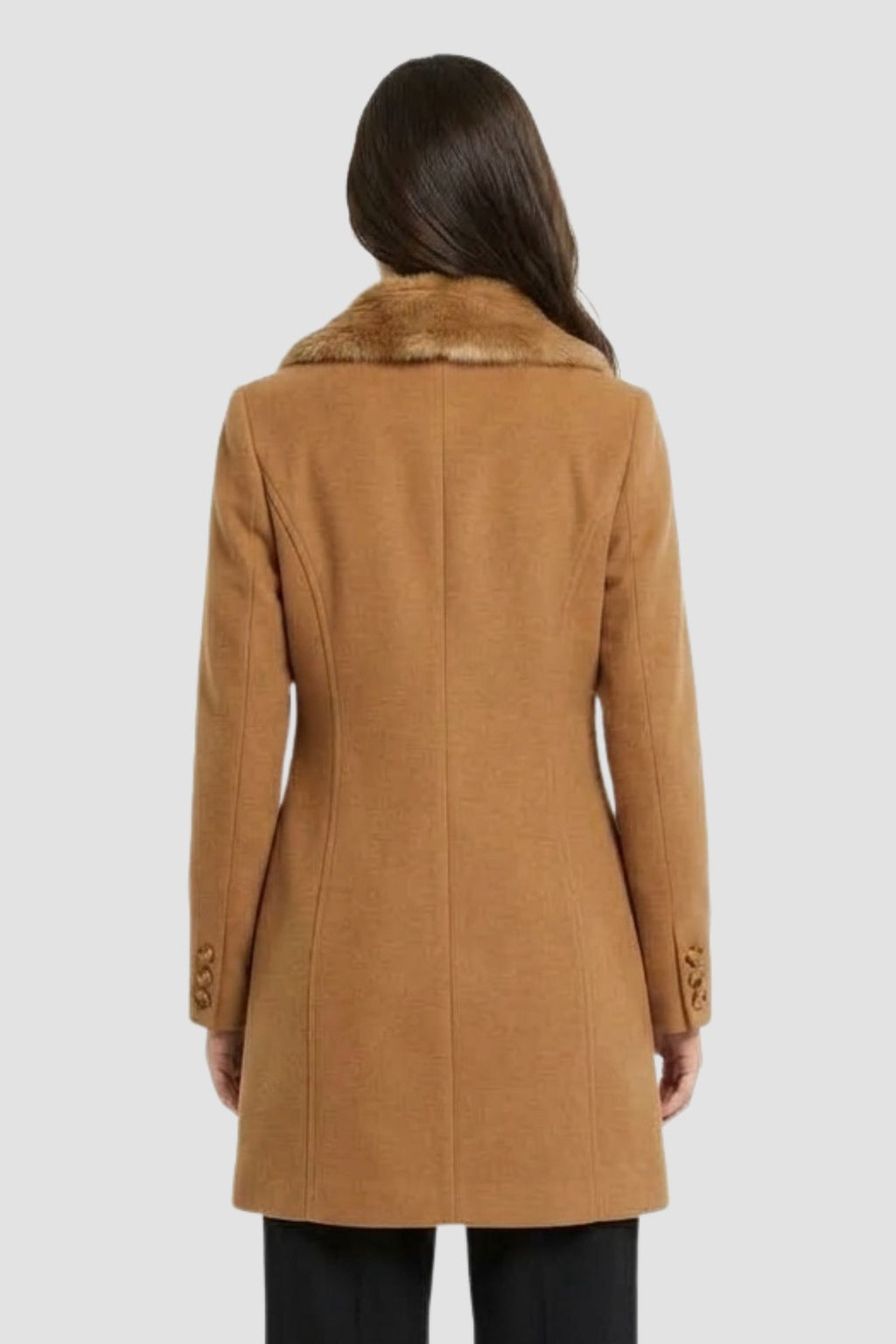 Back view of camel brown faux fur overcoat showing tailored back seams and button cuff detail