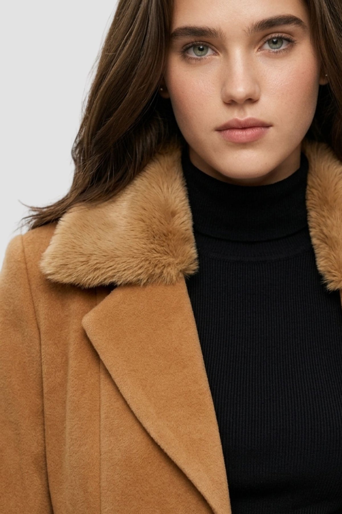 Close-up of camel brown faux fur overcoat showing faux fur collar and notch lapel detail