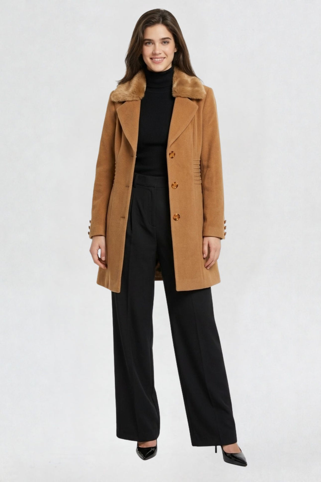 women's camel brown faux fur overcoat, front view, faux fur collar and button closure, styled with black turtleneck and trousers