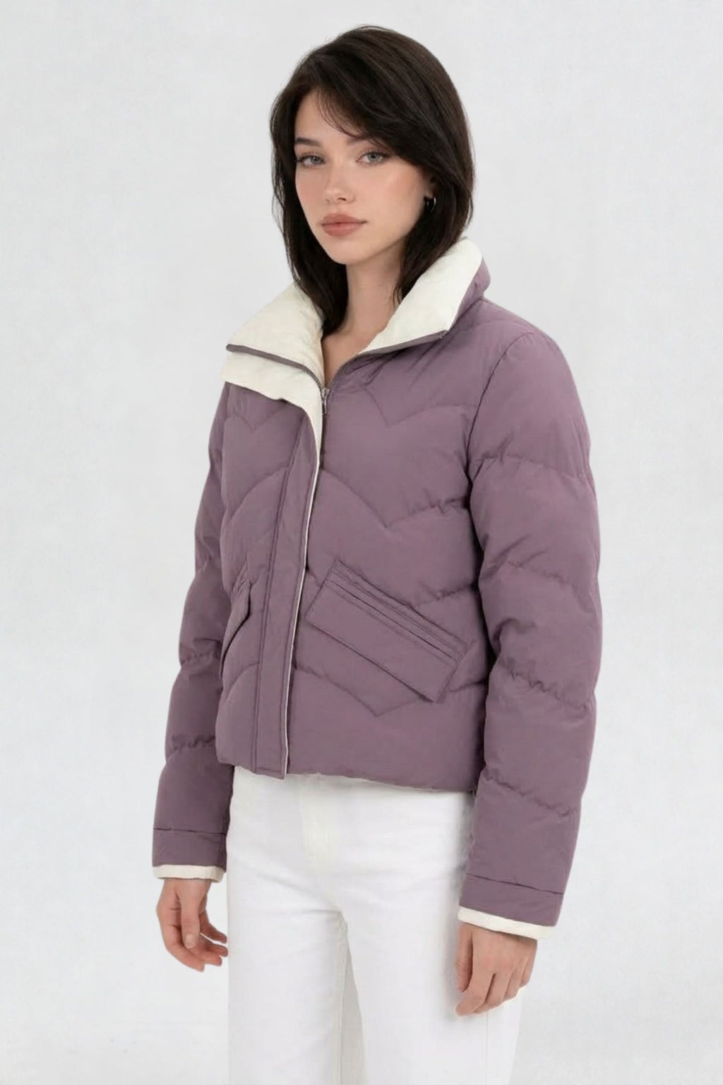 Side view of mauve purple puffer jacket showing cream contrast collar and flap pocket detail