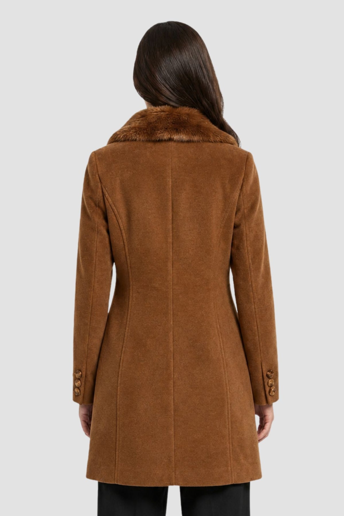 Back view of tan brown faux fur overcoat showing tailored back seams and button cuff detail