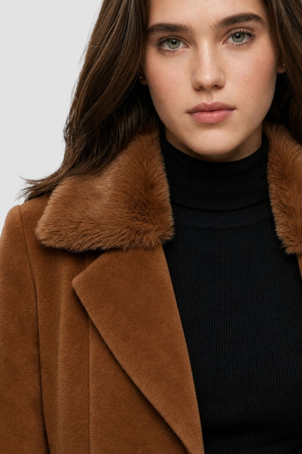 Close-up of tan brown faux fur overcoat showing faux fur collar and notch lapel detail