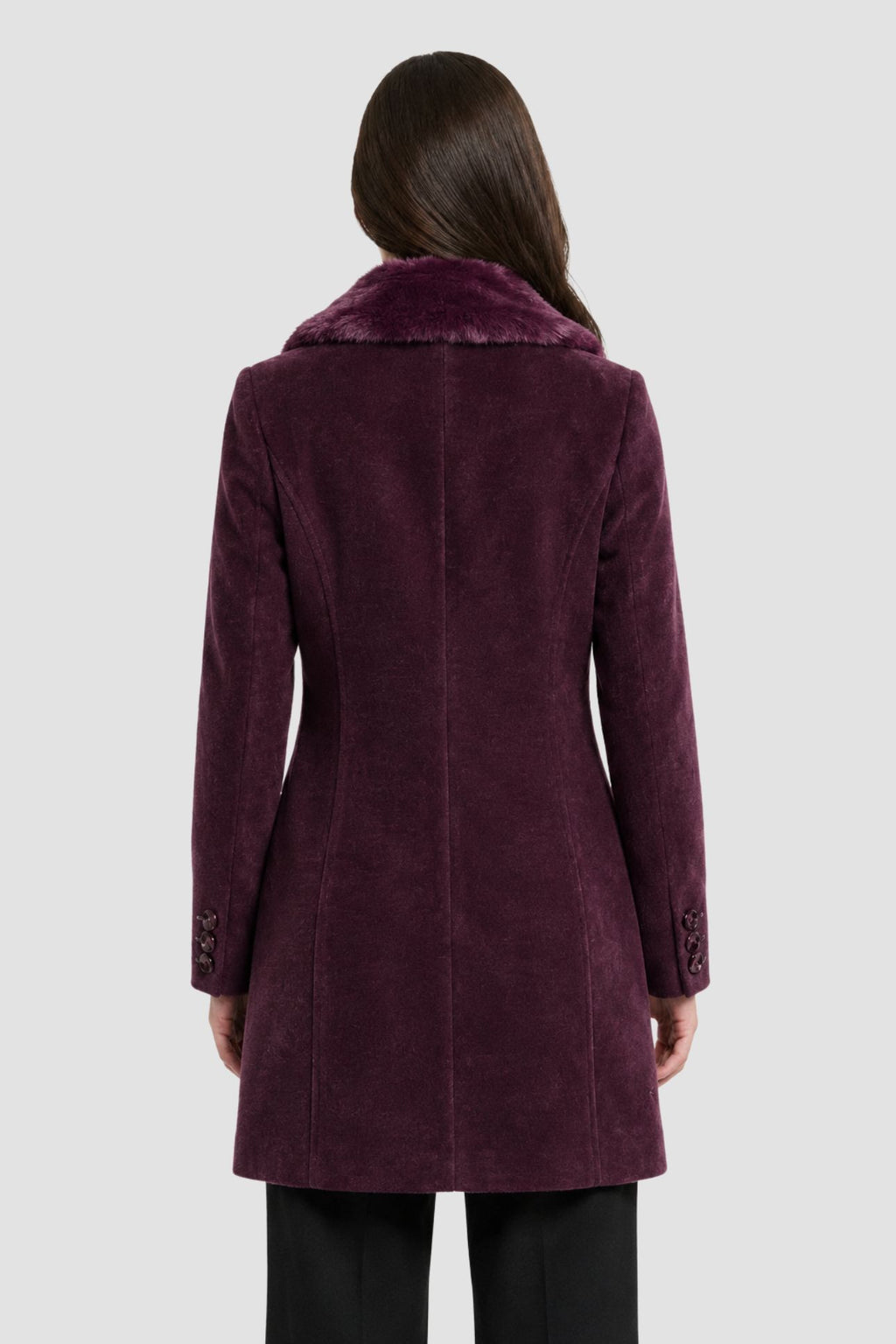 Back view of wine purple faux fur overcoat showing tailored back seams and button cuff detail