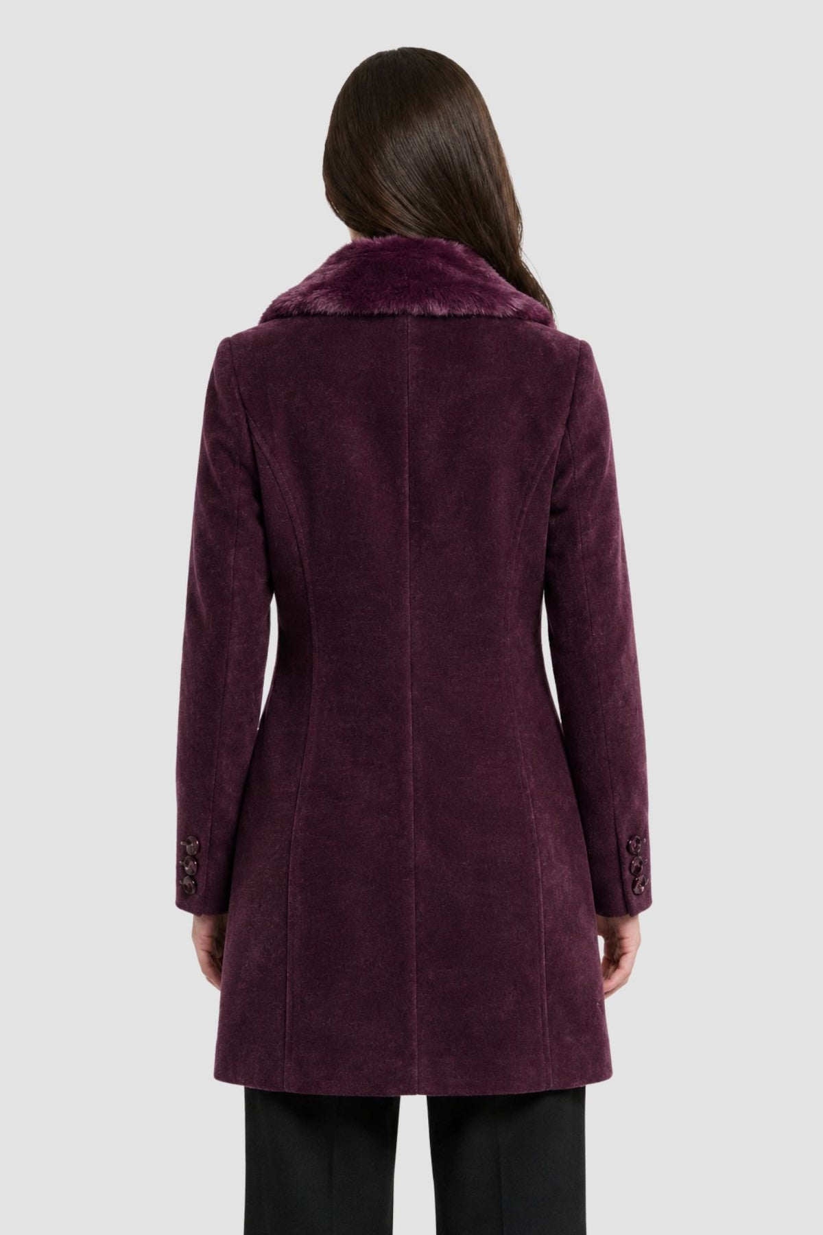 Back view of wine purple faux fur overcoat showing tailored back seams and button cuff detail