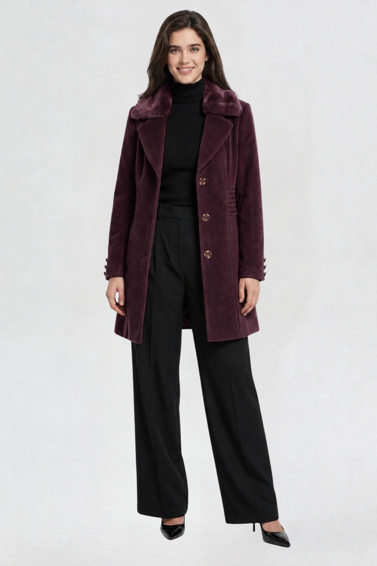women's wine purple faux fur overcoat, front view, faux fur collar and button closure, styled with black turtleneck and trousers